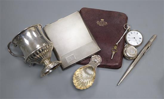 A silver cigarette case, caddy spoon, fob watch, christening mug and sovereign case(a.f.).